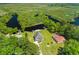 Aerial view of the property showing the home, private river access, and surrounding lush landscape at 643 Backfield Rd, Walterboro, SC 29488