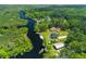 Stunning aerial view of waterfront home with dock and lush green surroundings at 643 Backfield Rd, Walterboro, SC 29488