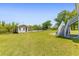 A lush, green backyard leads to a private pier and boathouse on the tranquil river at 643 Backfield Rd, Walterboro, SC 29488