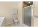 Bathroom features a toilet, shower with glass door, medicine cabinet, and tiled floors at 643 Backfield Rd, Walterboro, SC 29488