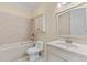 Bathroom featuring a jetted tub, toilet, tile shower and vanity with sink at 643 Backfield Rd, Walterboro, SC 29488