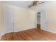 View of the bright bedroom with hardwood floors, crown molding, and access to the hallway at 643 Backfield Rd, Walterboro, SC 29488