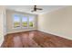 Bright bedroom featuring wood flooring, large windows overlooking a scenic water view, and neutral walls at 643 Backfield Rd, Walterboro, SC 29488