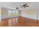 Large bonus room offers hardwood floors, wainscoting and multiple windows at 643 Backfield Rd, Walterboro, SC 29488