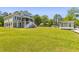 Exterior view of the home with a large yard and a private shed at 643 Backfield Rd, Walterboro, SC 29488