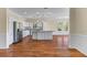 Well-lit kitchen featuring stainless steel appliances, granite countertops, and a kitchen island at 643 Backfield Rd, Walterboro, SC 29488