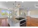 Kitchen features granite island cooktop combo and is open to the living area with scenic view at 643 Backfield Rd, Walterboro, SC 29488