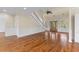 Bright open-concept living area with hardwood floors, featuring a grand staircase and stylish decor at 643 Backfield Rd, Walterboro, SC 29488