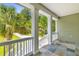 Charming porch with white pillars and slate tile, providing stunning outdoor views at 643 Backfield Rd, Walterboro, SC 29488