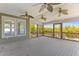 Wide, covered porch provides tranquil water view, wood plank floor and ceiling fans at 643 Backfield Rd, Walterboro, SC 29488