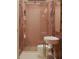 Charming bathroom featuring a patterned wallpaper and glass shower, with updated modern fixtures at 8 Homel Pl, Charleston, SC 29403