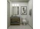Contemporary bathroom featuring a stone sink, open shelving, and stylish art at 8 Homel Pl, Charleston, SC 29403