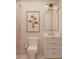 Charming bathroom with a framed floral print, single vanity, and a glass-enclosed shower at 8 Homel Pl, Charleston, SC 29403