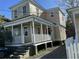 Quaint house featuring a classic front porch and a well-maintained yard at 8 Homel Pl, Charleston, SC 29403