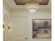 Chic hallway featuring a decorative chandelier, modern sconces, and abstract artwork creating a stylish atmosphere at 8 Homel Pl, Charleston, SC 29403