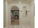 Charming hallway with an archway view of the dining area, showcasing the open layout and sophisticated design at 8 Homel Pl, Charleston, SC 29403