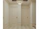 Bright hallway featuring checkerboard tile floor and a crystal chandelier at 8 Homel Pl, Charleston, SC 29403