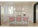 Elegant kitchen with marble countertops, counter seating and modern appliances at 8 Homel Pl, Charleston, SC 29403