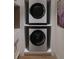Practical laundry area showcases stacked washer and dryer units, maximizing space and adding convenience to daily routines at 8 Homel Pl, Charleston, SC 29403