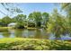 Scenic backyard view of the lake and house at 8483 Yadkin Cir # C, North Charleston, SC 29418