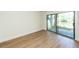 Bedroom featuring hardwood floors and sliding glass door to the exterior at 8483 Yadkin Cir # C, North Charleston, SC 29418