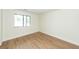Bright bedroom with large window, neutral walls, and hardwood flooring at 8483 Yadkin Cir # C, North Charleston, SC 29418