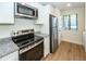 Updated kitchen with white cabinets, granite counters and stainless steel appliances at 8483 Yadkin Cir # C, North Charleston, SC 29418