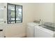 The laundry room features white washer and dryer, and a window at 8483 Yadkin Cir # C, North Charleston, SC 29418