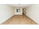 Bright living room featuring hardwood floors and a pass-through window to the kitchen at 8483 Yadkin Cir # C, North Charleston, SC 29418