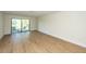 Living room features wood floors and access to outdoor patio at 8483 Yadkin Cir # C, North Charleston, SC 29418