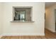Open pass-through window from the living room to the kitchen with a granite counter at 8483 Yadkin Cir # C, North Charleston, SC 29418