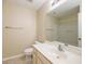 Bathroom with a white sink and toilet, a neutral color palette, and a shower at 8679 Grassy Oak Trl, North Charleston, SC 29420