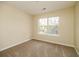 Bedroom with carpeted floors, a neutral color palette, and a window at 8679 Grassy Oak Trl, North Charleston, SC 29420