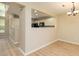 Dining room area featuring an opening to the kitchen and hardwood floors at 8679 Grassy Oak Trl, North Charleston, SC 29420