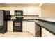 Kitchen featuring black appliances, countertops, and ample cabinet space at 8679 Grassy Oak Trl, North Charleston, SC 29420