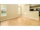 Bright living room with large windows and wood flooring at 8679 Grassy Oak Trl, North Charleston, SC 29420