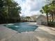 Community pool covered for the off-season, surrounded by trees, offering a private and serene setting at 8679 Grassy Oak Trl, North Charleston, SC 29420