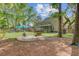 Expansive backyard featuring a swing set, seating area, and lush landscaping, perfect for outdoor enjoyment at 8781 Laurel Grove Ln, North Charleston, SC 29420