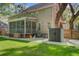 A spacious backyard features a covered porch, playset, and storage, ideal for outdoor fun at 8781 Laurel Grove Ln, North Charleston, SC 29420