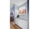 A bar area in the house is shown with white cabinetry and a small sink at 8781 Laurel Grove Ln, North Charleston, SC 29420