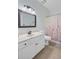 Bathroom showcasing white vanity and floral shower curtain at 8781 Laurel Grove Ln, North Charleston, SC 29420