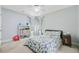 Well-lit bedroom with ceiling fan, blue curtains, and lots of storage space at 8781 Laurel Grove Ln, North Charleston, SC 29420