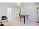 Versatile bonus room featuring a foosball table, neutral walls and connecting rooms at 8781 Laurel Grove Ln, North Charleston, SC 29420