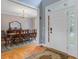 Bright dining room featuring hardwood floors, a chandelier, and an elegant table set for a gathering at 8781 Laurel Grove Ln, North Charleston, SC 29420