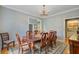 Elegant dining room with hardwood floors, chandelier, and classic furniture, adjacent to other living spaces at 8781 Laurel Grove Ln, North Charleston, SC 29420