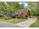 An impressive two-story brick home, with mature landscaping, and an inviting front porch at 8781 Laurel Grove Ln, North Charleston, SC 29420