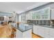 Spacious kitchen with island seating and view into living room at 8781 Laurel Grove Ln, North Charleston, SC 29420
