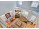 Aerial view of a living room with high ceilings, a fireplace, and hardwood floors at 8781 Laurel Grove Ln, North Charleston, SC 29420