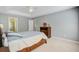 Main bedroom with tray ceiling, neutral walls, and lots of natural light at 8781 Laurel Grove Ln, North Charleston, SC 29420
