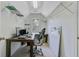 A comfortable office with desk, chair, computer and shelves for organizing your space at 8781 Laurel Grove Ln, North Charleston, SC 29420